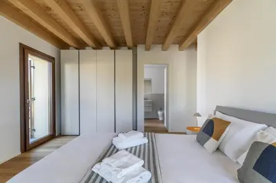 Letto o letti in una camera di Molino4 by WelcHome
