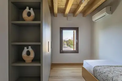 Letto o letti in una camera di Molino4 by WelcHome