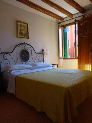 Letto o letti in una camera di Hotel Minerva & Nettuno di Venezia