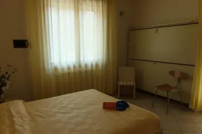 Letto o letti in una camera di Hotel Nettuno