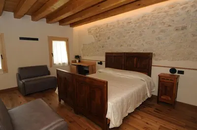 Letto o letti in una camera di Casa Tormena