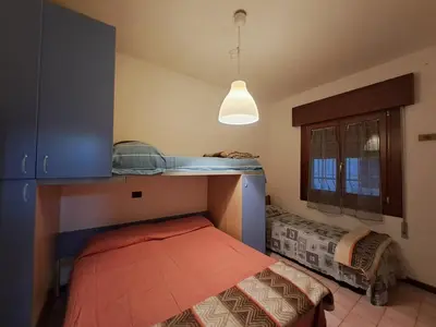 Letto o letti in una camera di Villa Monica - Seasons Real Estate - Lido di Jesolo