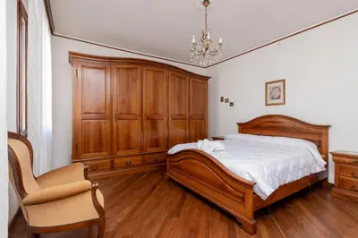 Letto o letti in una camera di GuestHost - Andrea House With Parking