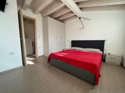 Letto o letti in una camera di Appartamento con vista laguna