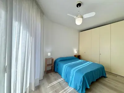 Letto o letti in una camera di Tritone 12 - Carraro Immobiliare - Family Apartments