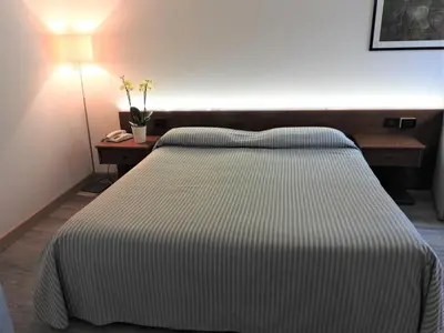 Letto o letti in una camera di Albergo Centrale