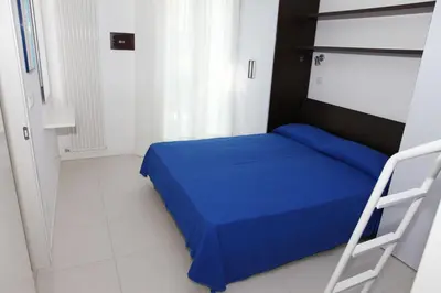 Letto o letti in una camera di Residence Mediterranee Family Apartments