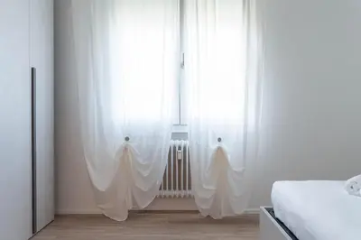 Letto o letti in una camera di Casa Mantegna