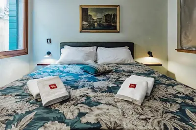 Letto o letti in una camera di Palazzino Veneziano - Charme in the Serenissima