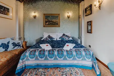 Letto o letti in una camera di Palazzino Veneziano - Charme in the Serenissima