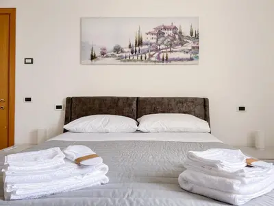 Letto o letti in una camera di Villa Cattarin