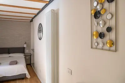 Letto o letti in una camera di Basilica Prestige Residence, lusso e comfort