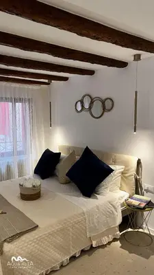 Letto o letti in una camera di Aqua Alta