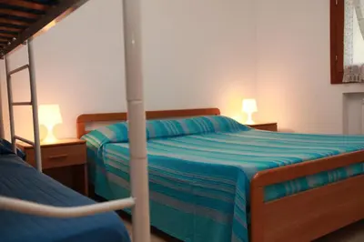Letto o letti in una camera di Gildo