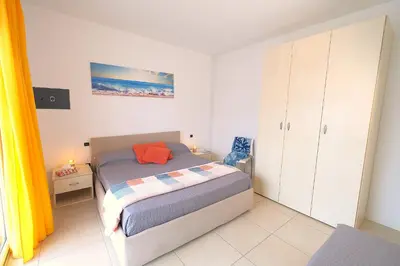 Letto o letti in una camera di Residence Laguna Park Piazza Brescia