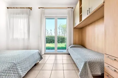 Letto o letti in una camera di Jesolo Garden Beach House - Host Solution