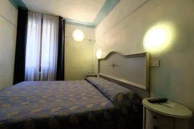 Letto o letti in una camera di Hotel ai do Mori