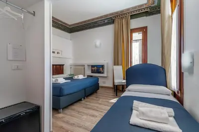 Letto o letti in una camera di Hotel ai do Mori