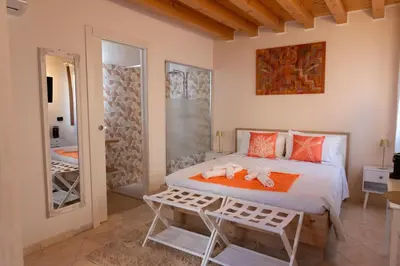 Letto o letti in una camera di Cà Vecia - Apartments & Rooms
