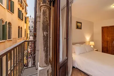 Letto o letti in una camera di Torre dell'orologio Apartment by Bricola Apartments