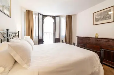Letto o letti in una camera di Torre dell'orologio Apartment by Bricola Apartments
