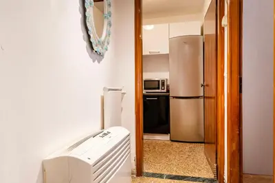 Cucina o angolo cottura di Torre dell'orologio Apartment by Bricola Apartments