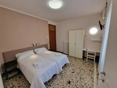 Letto o letti in una camera di Albergo D'Ambros - Casa Belfiore Group