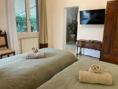 Letto o letti in una camera di Casa Rossana - 15min from Venice