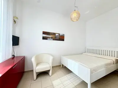 Letto o letti in una camera di Residence Solmare - Carraro Immobiliare - Family Apartments