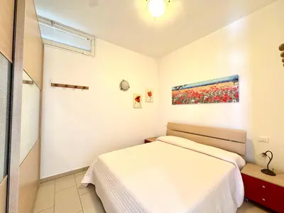 Letto o letti in una camera di Residence Solmare - Carraro Immobiliare - Family Apartments