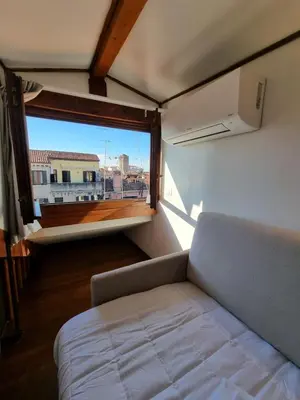 Letto o letti in una camera di Marzia Home