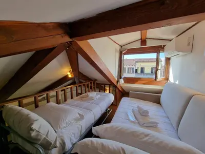 Letto o letti in una camera di Marzia Home