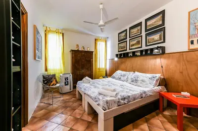 Letto o letti in una camera di Cà Tolentini