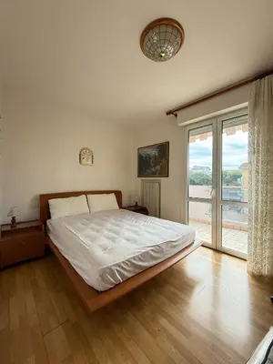 Letto o letti in una camera di CONDOMINIO ANNA- Solo per Famiglie- WALTERIGATO APARTMENTS