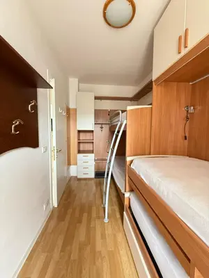 Letto o letti in una camera di CONDOMINIO ANNA- Solo per Famiglie- WALTERIGATO APARTMENTS