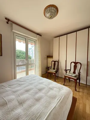 Letto o letti in una camera di CONDOMINIO ANNA- Solo per Famiglie- WALTERIGATO APARTMENTS