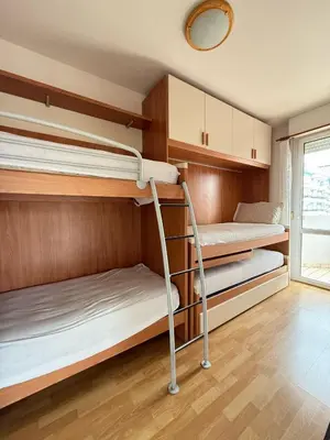 Letto o letti in una camera di CONDOMINIO ANNA- Solo per Famiglie- WALTERIGATO APARTMENTS