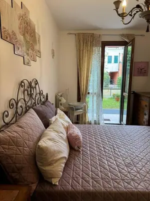 Letto o letti in una camera di Ca'Ilaria vacanze al mare a due passi da Venezia