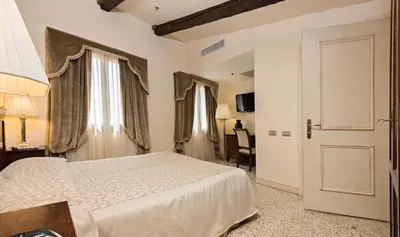 Letto o letti in una camera di Hotel Dell'Opera