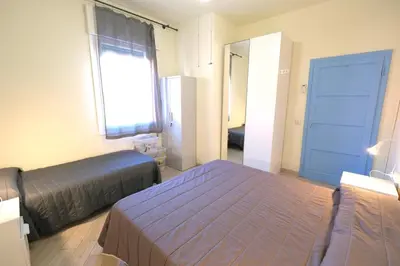 Letto o letti in una camera di CASA ROSSA tre camere in centro