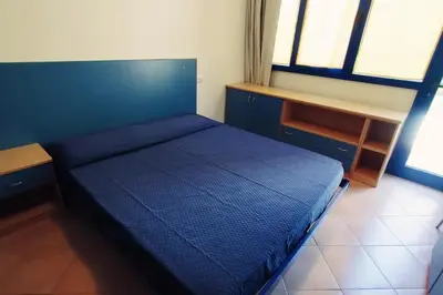 Letto o letti in una camera di Casa Penelope
