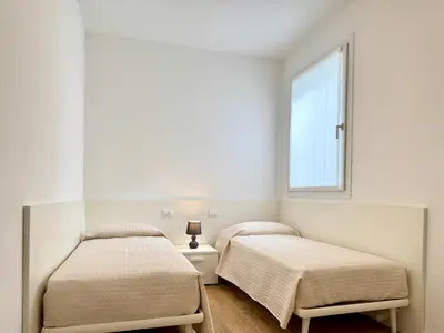 Letto o letti in una camera di J Eight - Carraro Immobiliare - Family Apartments