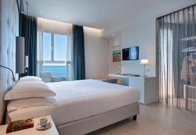 Letto o letti in una camera di Hotel Orient & Pacific