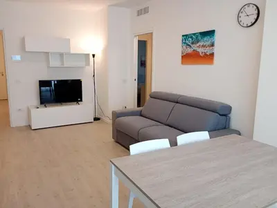 TV o dispositivi per l'intrattenimento presso Residence Florinas con piscina - Family Apartments Lido di Jesolo