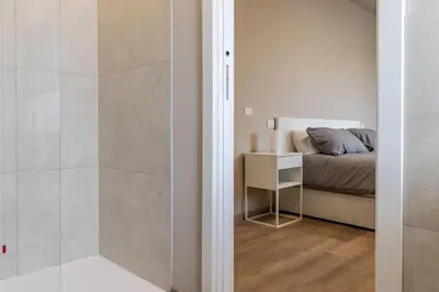 Letto o letti in una camera di IdealHome Suite