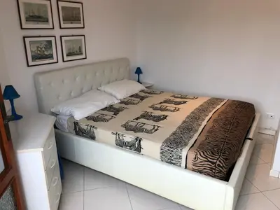 Letto o letti in una camera di RESIDENCE GALLO - WALTERIGATO Apartments PER SOLO FAMIGLIE