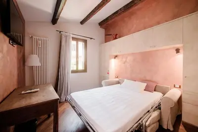 Letto o letti in una camera di Rosso Veneziano
