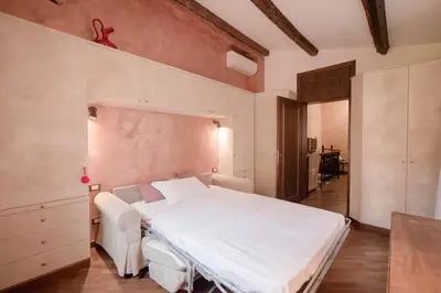 Letto o letti in una camera di Rosso Veneziano