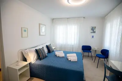 Letto o letti in una camera di CASA LILLY camere matrimoniali con bagno privato