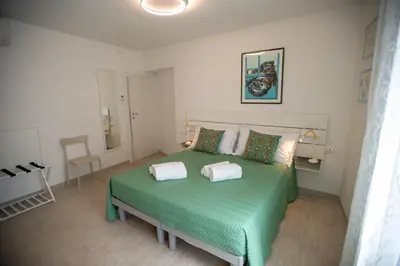 Letto o letti in una camera di CASA LILLY camere matrimoniali con bagno privato